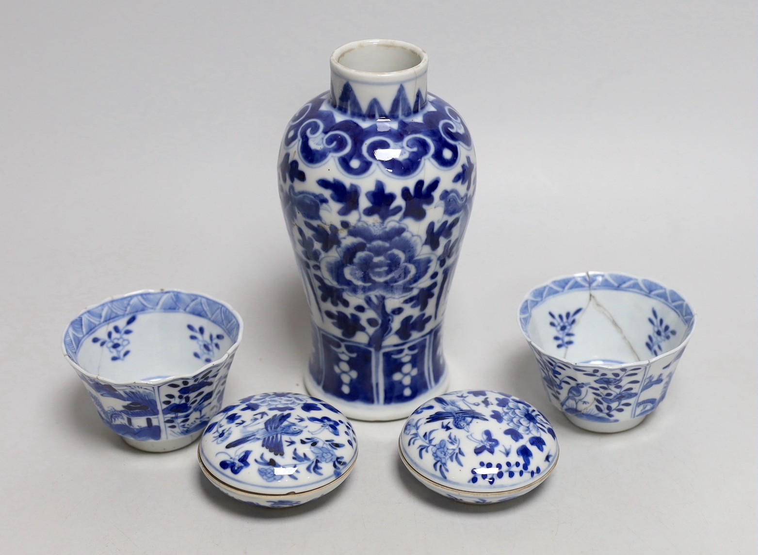 A Chinese blue and white phoenix decorated vase, a pair of circular boxes and a pair of damaged tea bowls. Late 19th century Tallest 17.5cm